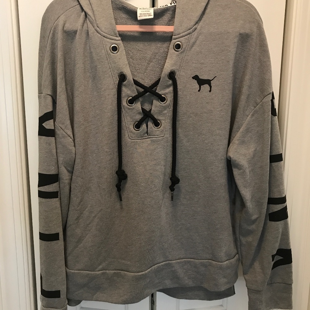 Pink victoria secret hoodie with grommets and lacing at center front/ large